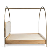 Side view of modern canopy bed with arched metal posts and wooden platform frame