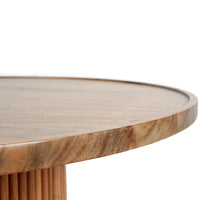Side profile of a round wooden coffee table showing the thin tabletop edge and fluted cylindrical base.