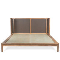 Front view of wooden bed with woven headboard and natural wood frame