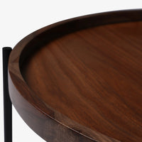 Close-up of raised edge on round walnut coffee table