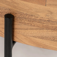 Close-up of black metal leg attached to wooden coffee table