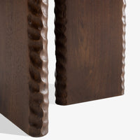 Close-up of Nashi wooden side table base with handcrafted carved edge detailing and dark wood finish.