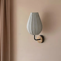 Beige fabric wall lamp with teardrop shade and wooden wall bracket