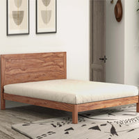 Natural wooden bed with rustic headboard and minimalist design in a modern bedroom