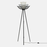 Tall black metal tripod floor lamp with layered wire basket lampshade