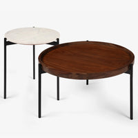 Round wooden and white marble coffee tables with black metal legs
