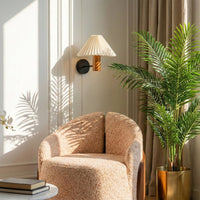 Modern pleated fabric wall lamp with wooden accent in a cozy living room