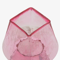 Close up of pink glass table lamp shade and glass base