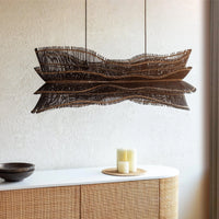 Textured black woven pendant light in a modern living room
