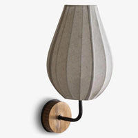 Teardrop shaped fabric wall sconce with wooden base for modern home interiors
