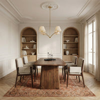 Modern wooden dining table with solid wood legs in a luxury dining room