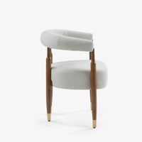 Side view of modern cream accent chair with wooden frame and legs