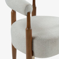 Front view of cream boucle accent chair with wooden legs