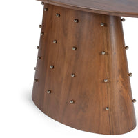 Close-up of round dining table edge and wooden pedestal detailing