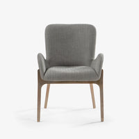 Modern grey fabric accent chair with wooden legs and curved armrests