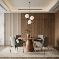 Round wooden dining table with sculptural pedestal base in modern dining area