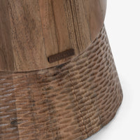 Close-up of textured wooden pedestal base on dining table
