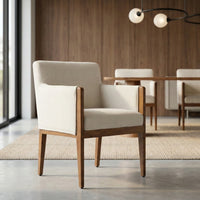 Cream upholstered dining chair with wooden frame in a luxury dining room