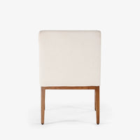 Back view of cream upholstered dining chair with wooden legs