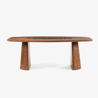 Side view of wooden dining table with black marble center and pedestal legs
