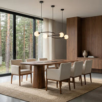 Modern dining room with wooden table and black marble tabletop detail