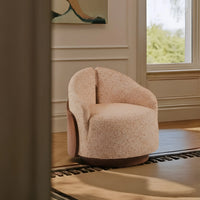 Modern beige upholstered accent chair in a luxury living room